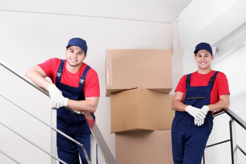 Office furniture and boxes arranged for a commercial move in Mitcham