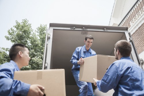 Local house moving team handling furniture near suburban homes in Mitcham