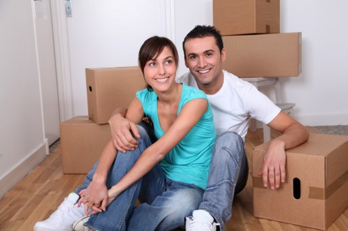 Removal van and moving team in a Mitcham residential street