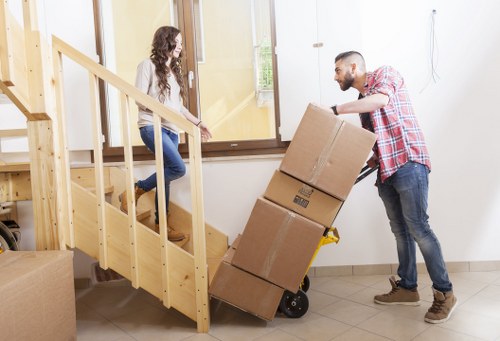 Moving boxes and household items with a man and van