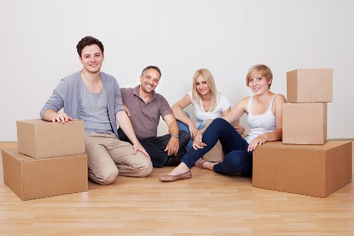 Careful wrapping of fragile household items during a Mitcham packing service