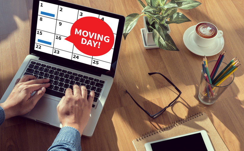 Movers handling desks and office furniture during a Mitcham relocation
